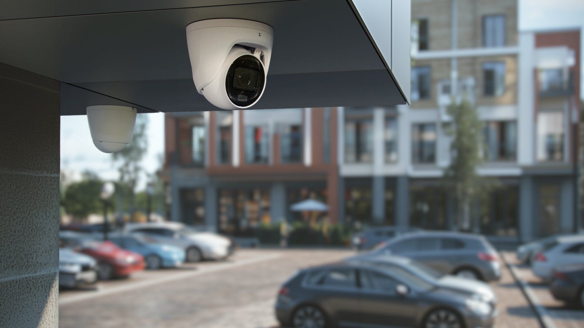 An Ajax TurretCam under a canopy overlooking a parking lot