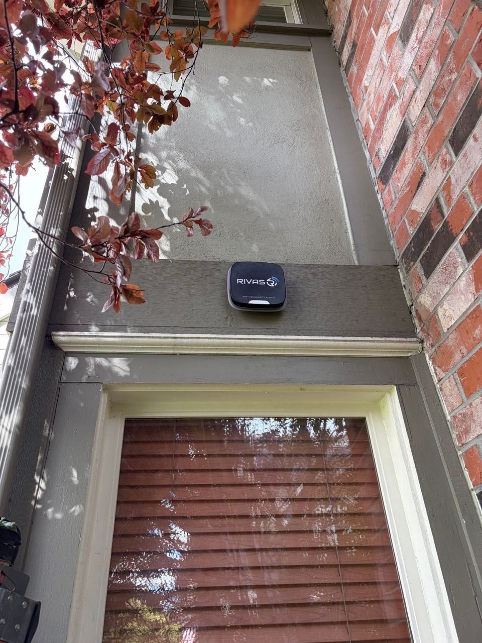 Security camera mounted on a brick wall